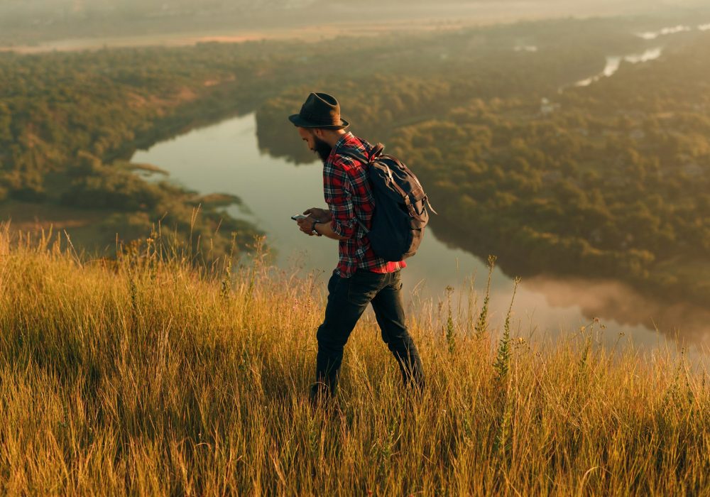 traveler-using-smartphone-in-nature.jpg traveler-using-smartphone-in-nature.jpg